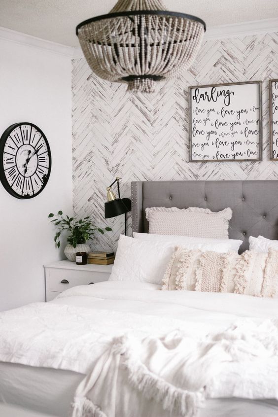white bedroom with an accent wall