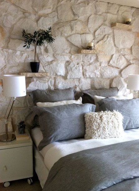 natural stone accent wall in a bedroom