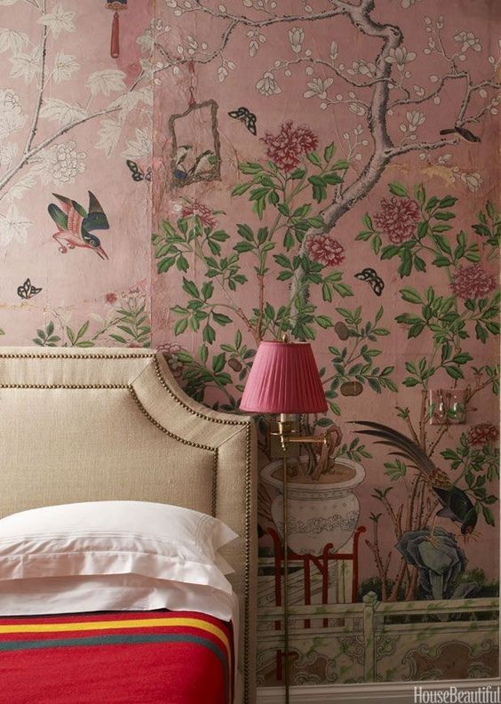 pink floral wallpapers as an accent wall in a bedroom