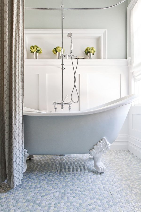 Elegant Bathroom With Claw Foot Bathtub And Pastel Blue Penny Tile Flooring