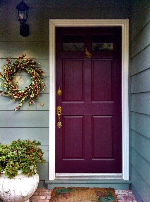 Front Door decor with wreath and potted plant
