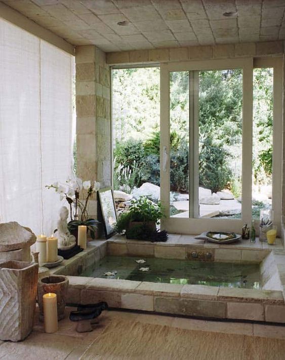 Asian bathroom design with sunken stone tub
