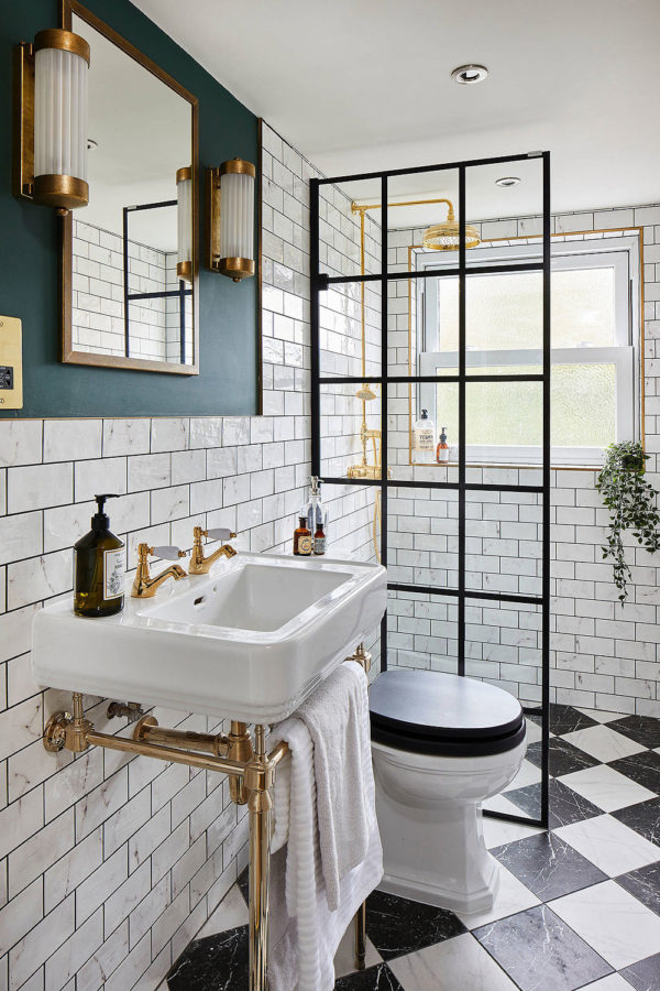 Victorian Bathroom with white subway tiled walls , gold accents, Checkerboard Floor 