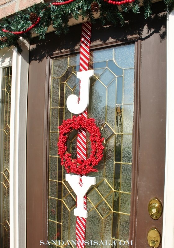 beautiful-front-door-decor with red berry wreath