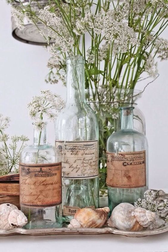 Cottage Decor With Old Bottles As Vases