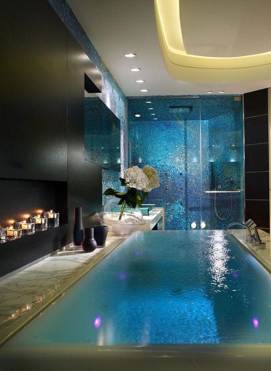 Beautiful black and blue bathroom with infinity tub