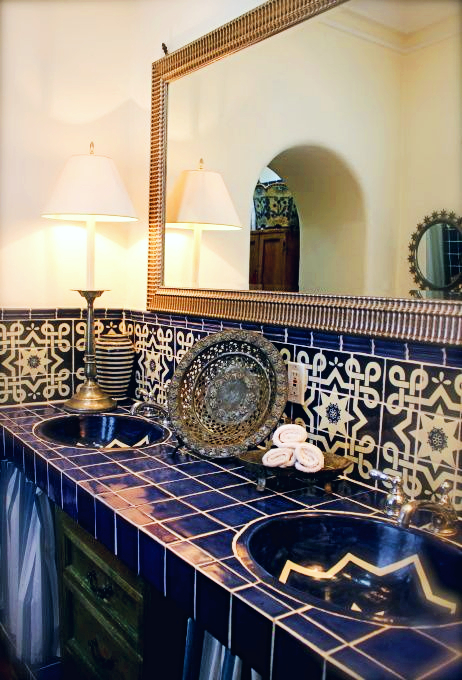 north african bathroom with custom tiled vanity and backsplash