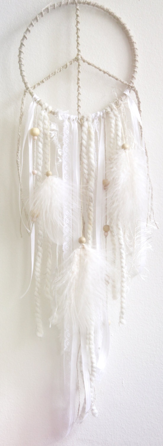 Pure white dream catchers with laces and feathers