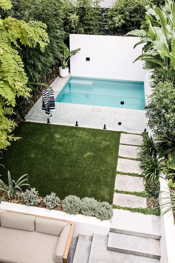 small swimming pool in a narrow garden
