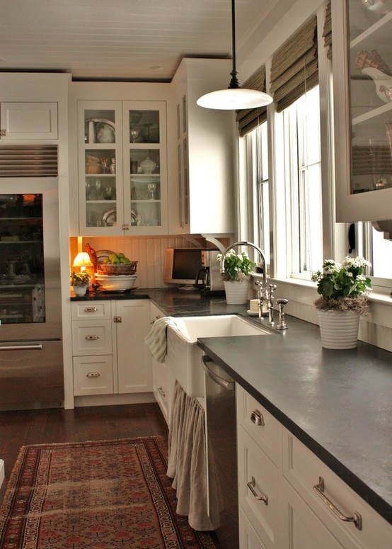White And Grey Kitchen With Sink Under A Window