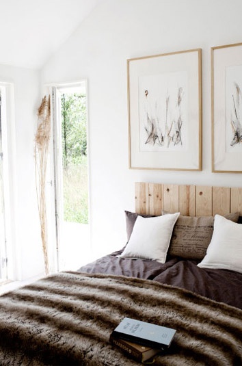 wooden headboard and paintings