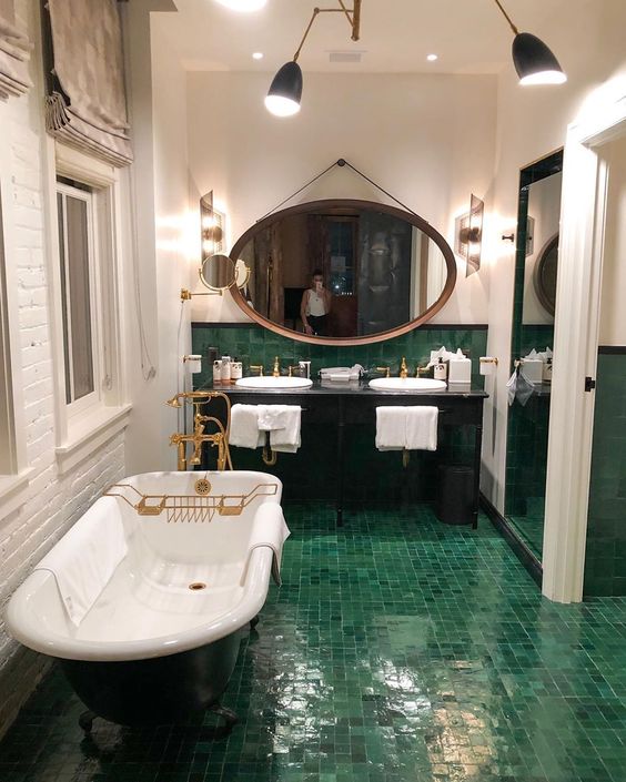 classy vintage bathroom with green tiled floor