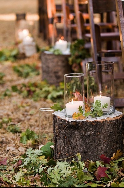 tree trunk and candles wedding aisle decor